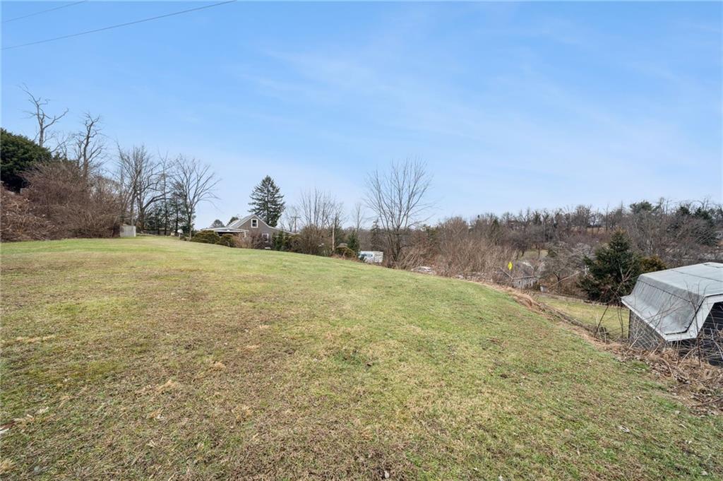 2052 McKinney Road Monroeville, PA 15146 - Photo 2 of 30 a view of a field with large trees