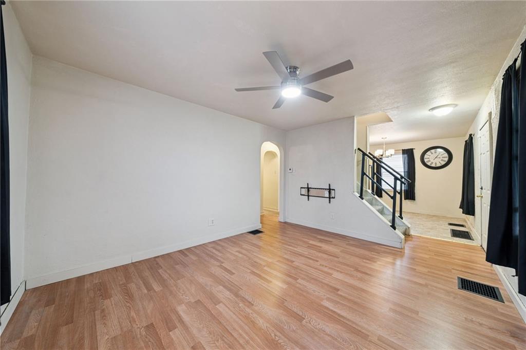 2052 McKinney Road Monroeville, PA 15146 - Photo 10 of 30 a view of empty room with wooden floor and ceiling fan