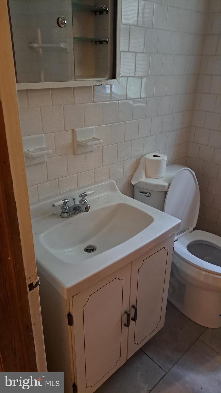 4401 East Joppa Road Perry Hall, MD 21236 - Photo 10 of 32 a bathroom with a sink and a toilet