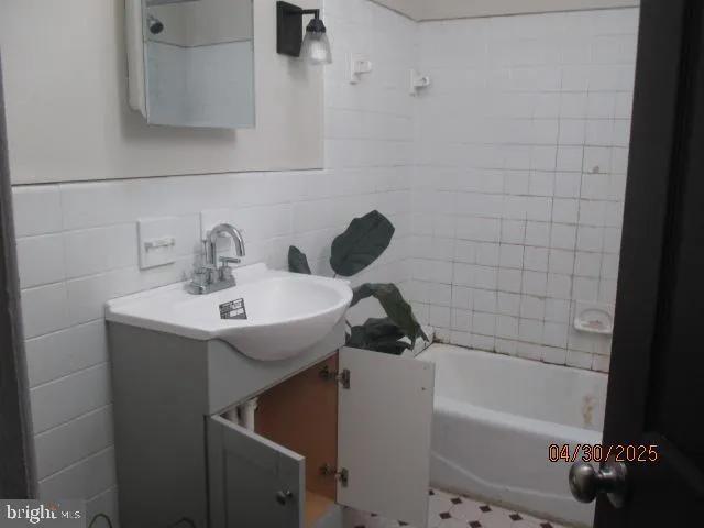 a bathroom with a sink and a bathtub