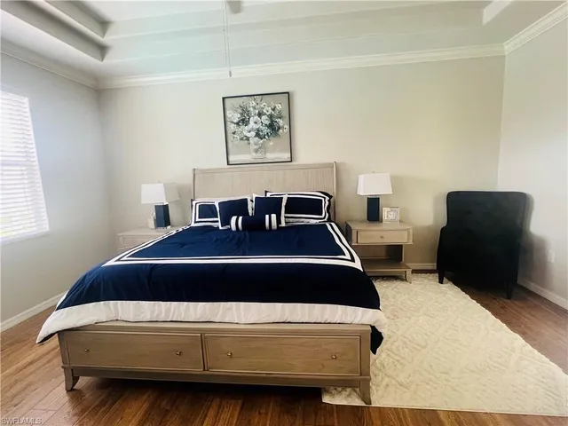 a bedroom with a bed and chair