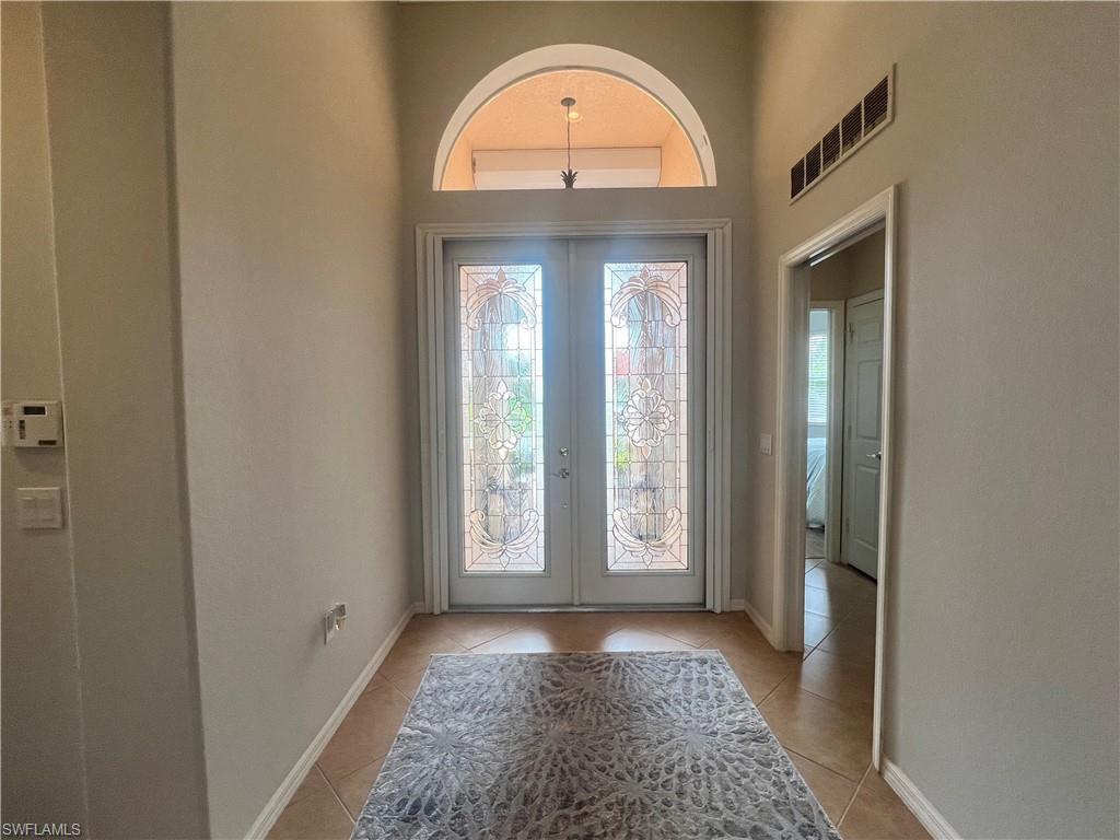 14265 Manchester Drive Naples, FL 34114 - Photo 2 of 35 a view of empty room with front door