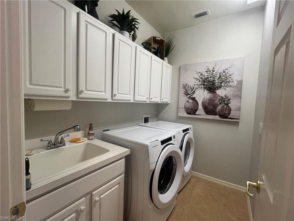 14265 Manchester Drive Naples, FL 34114 - Photo 21 of 35 a utility room with dryer and washer