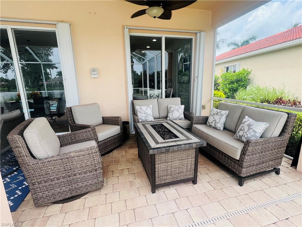 14265 Manchester Drive Naples, FL 34114 - Photo 22 of 35 a balcony with furniture and a large window