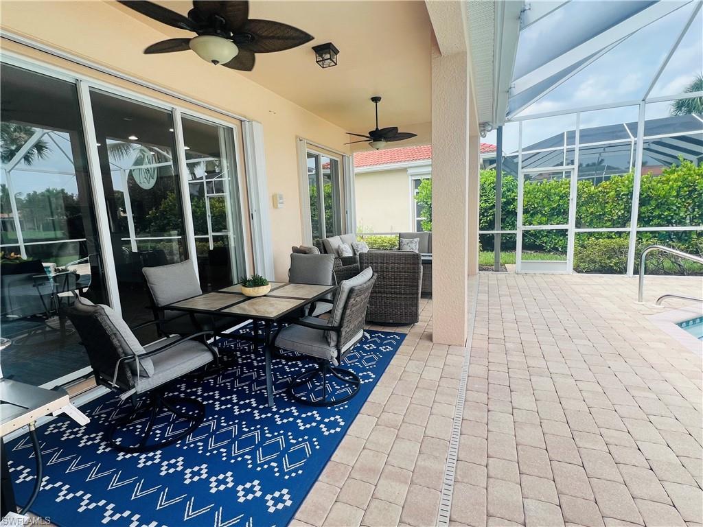 14265 Manchester Drive Naples, FL 34114 - Photo 24 of 35 a building outdoor space with patio furniture and potted plants