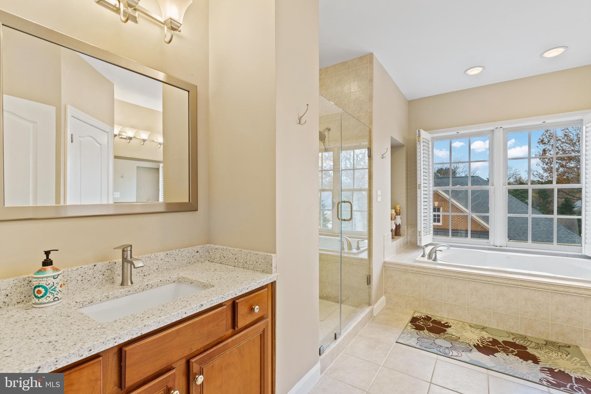 7429 Seneca Ridge Drive McLean, VA 22102 - Photo 26 of 48 Primary bedroom bath w/ shower and soaking tub