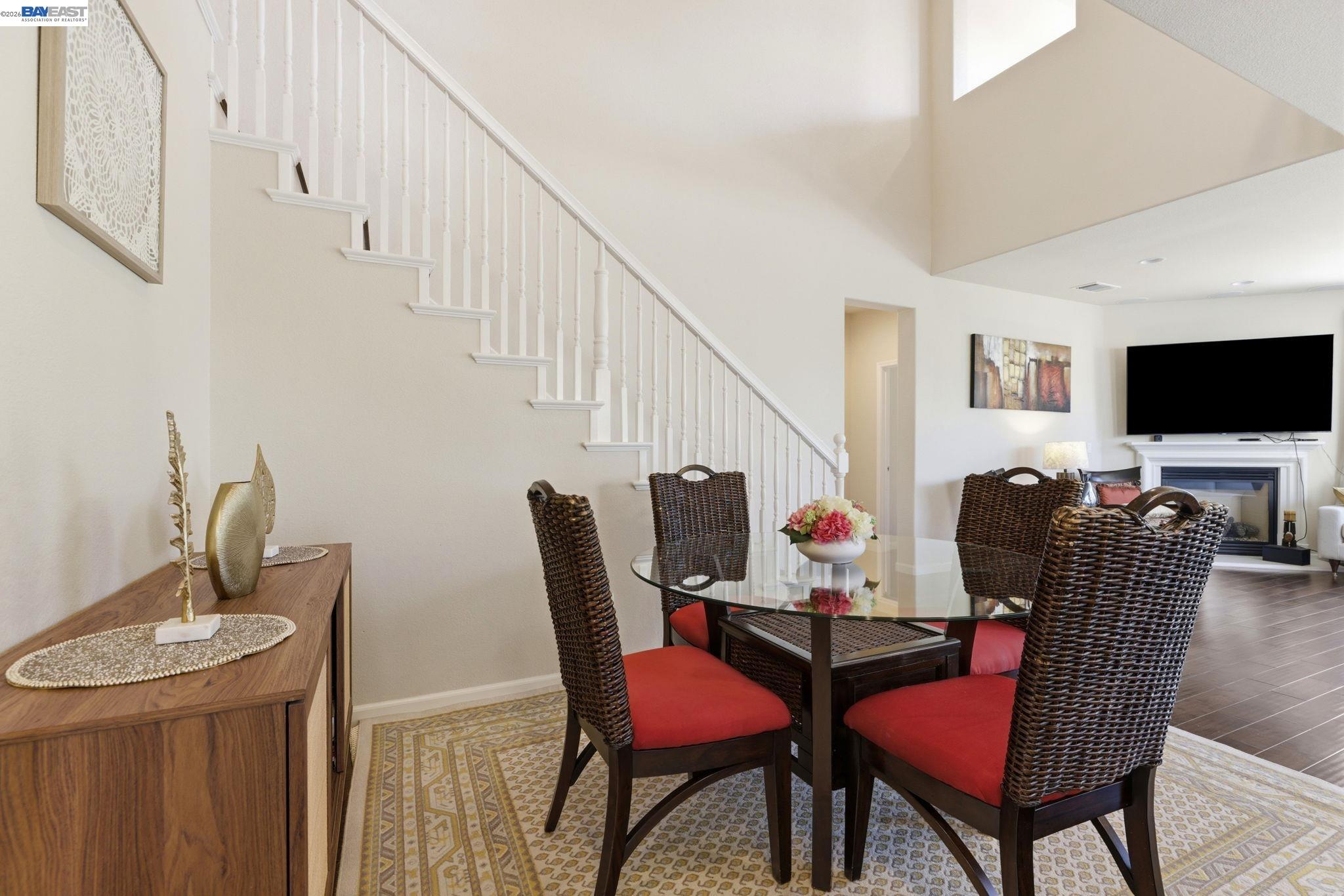 5029 Queensbury Way San Ramon, CA 94582 - Photo 13 of 58 a dining room with furniture and wooden floor