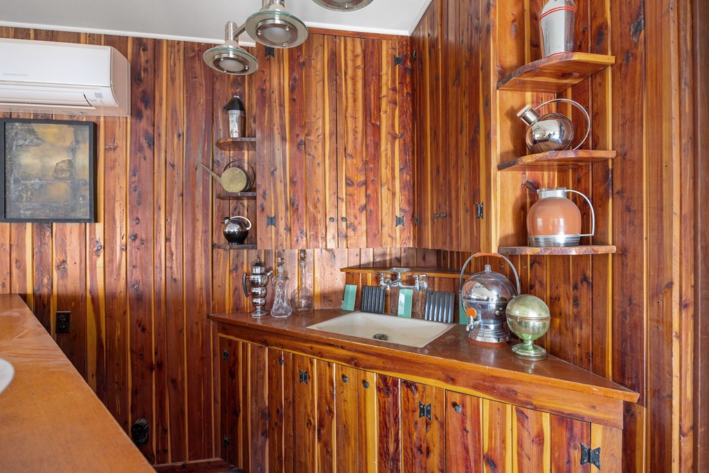 228 Galbraith Avenue Kerrville, TX 78028 - Photo 26 of 50 a view of a hallway with wooden floor and windows