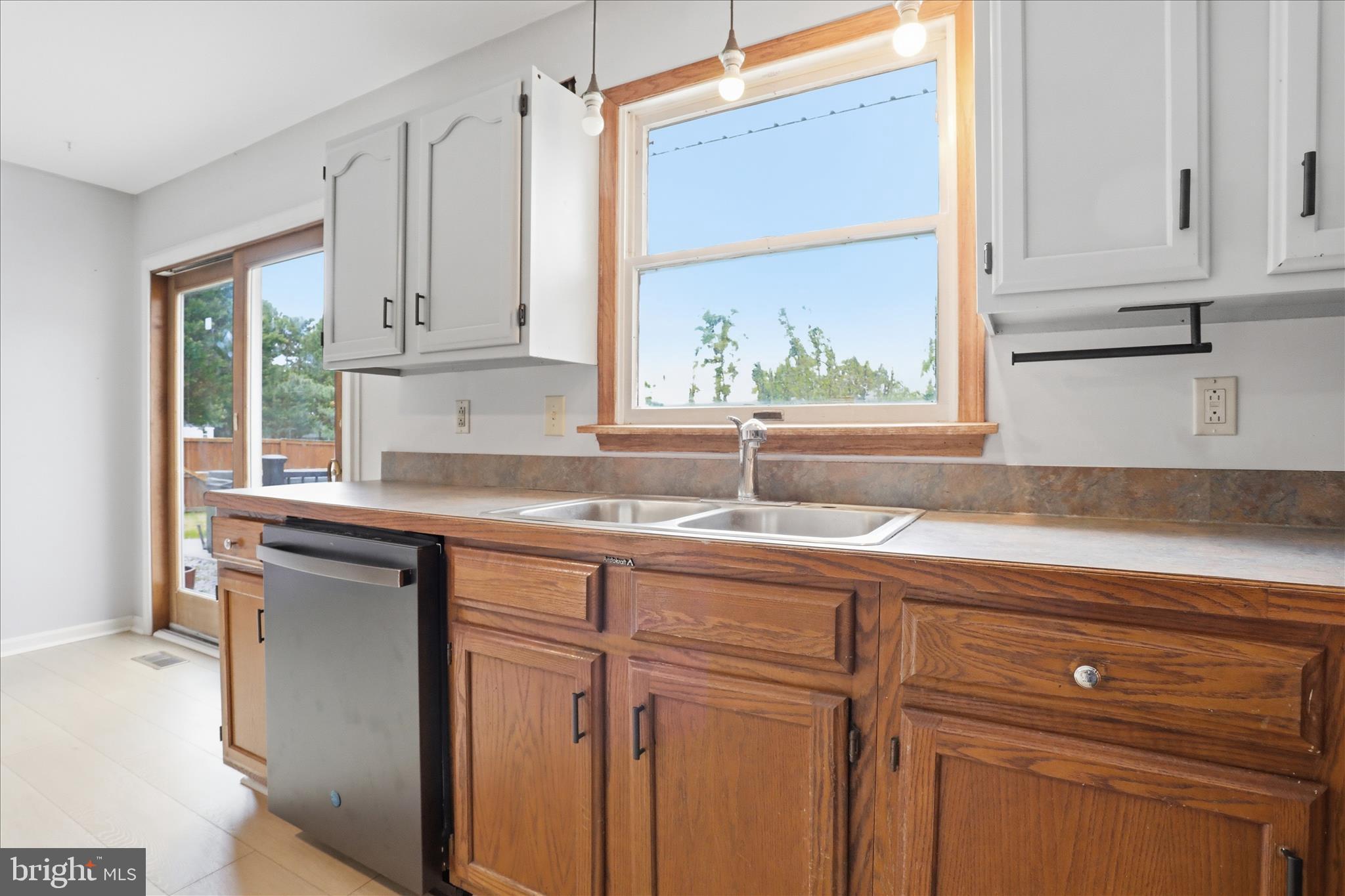 13733 Barnhart Road Clear Spring, MD 21722 - Photo 17 of 32 a kitchen with granite countertop white cabinets and a sink