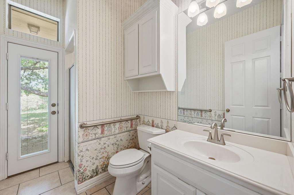 5513 Rustic Trail Colleyville, TX 76034 - Photo 14 of 40 a bathroom with a sink a toilet and shower