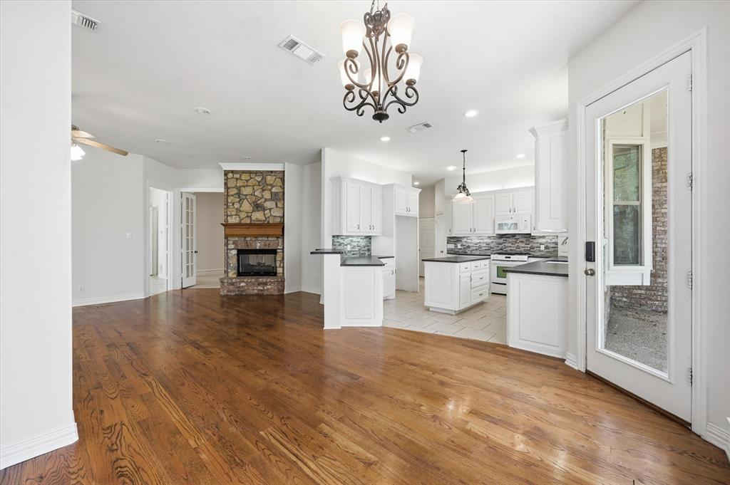 5513 Rustic Trail Colleyville, TX 76034 - Photo 19 of 40 a view of a kitchen with refrigerator and cabinets