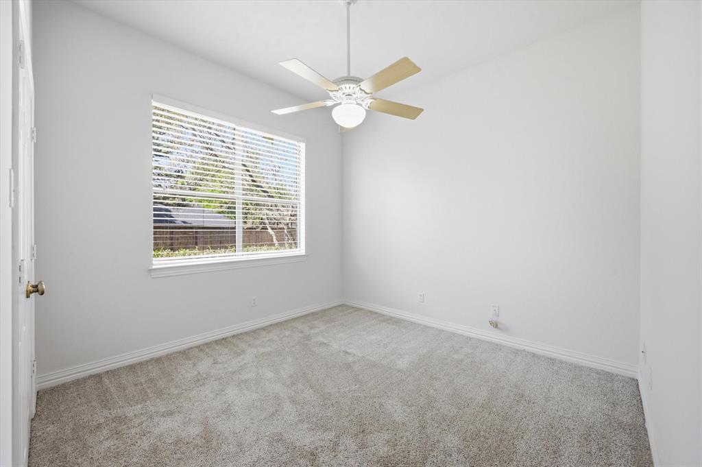 5513 Rustic Trail Colleyville, TX 76034 - Photo 20 of 40 a view of an empty room with a window