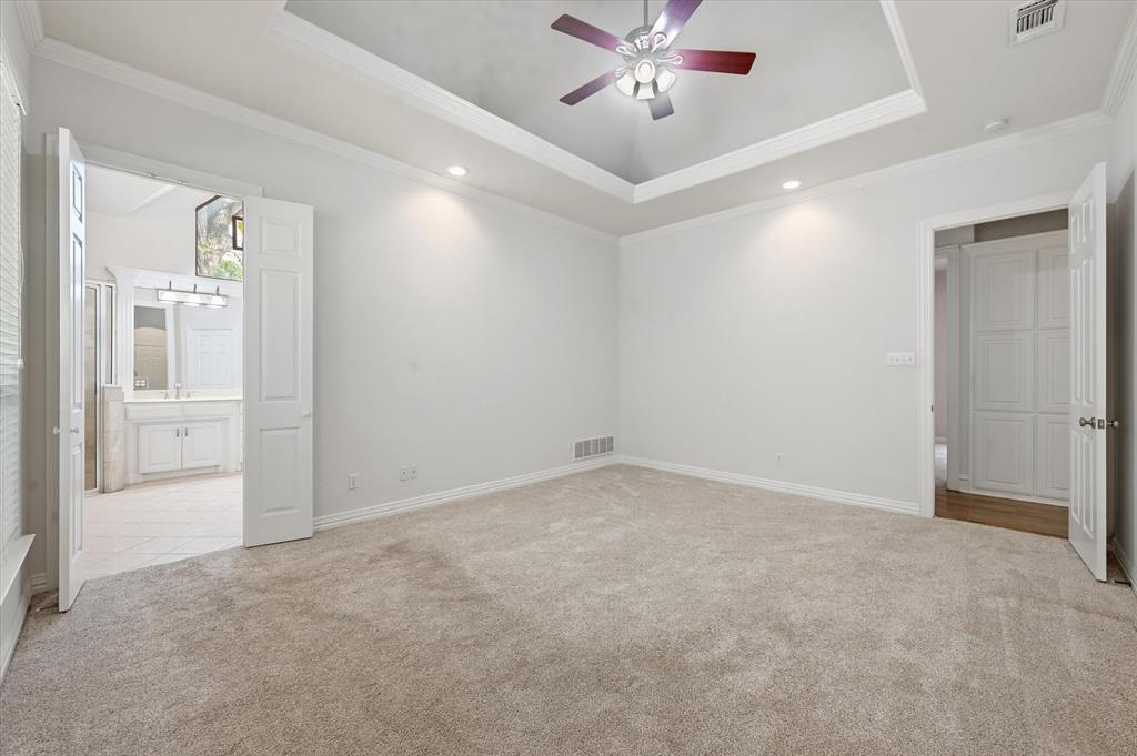 5513 Rustic Trail Colleyville, TX 76034 - Photo 26 of 40 an empty room with chandelier fan and closet area