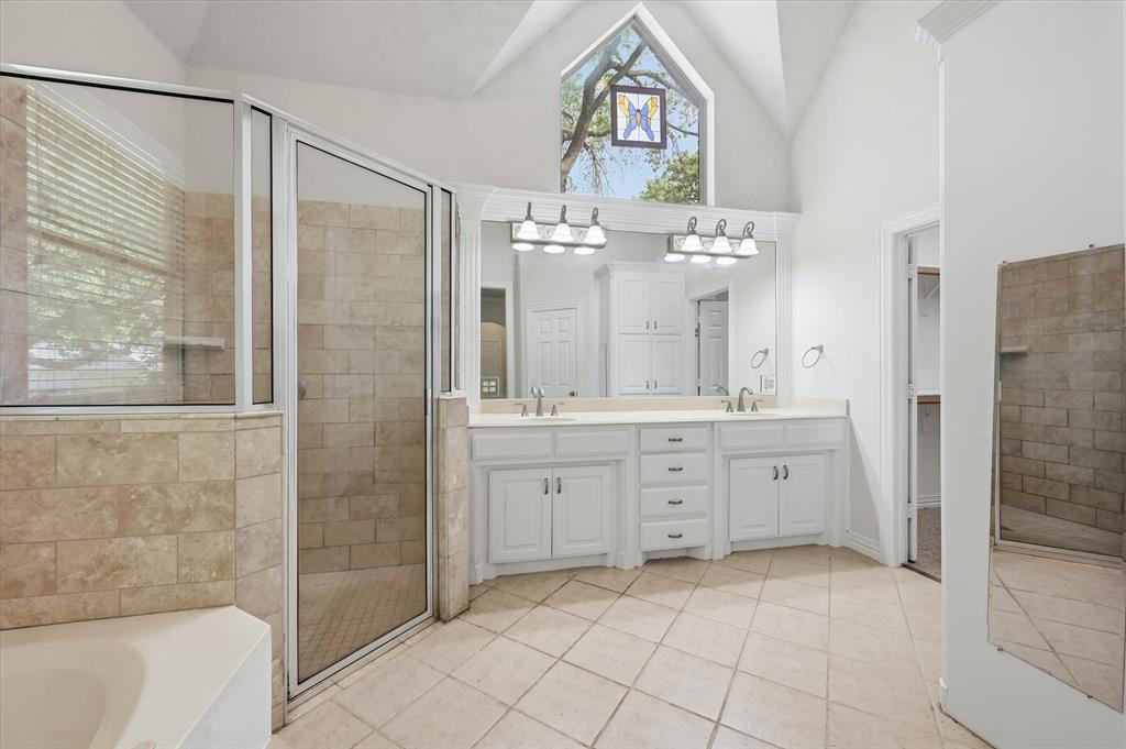 5513 Rustic Trail Colleyville, TX 76034 - Photo 30 of 40 a spacious bathroom with a double vanity sink mirror and shower