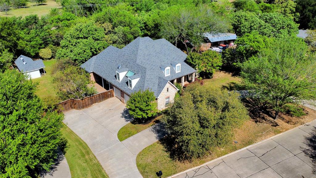 5513 Rustic Trail Colleyville, TX 76034 - Photo 39 of 40 an aerial view of a house with a yard and garden