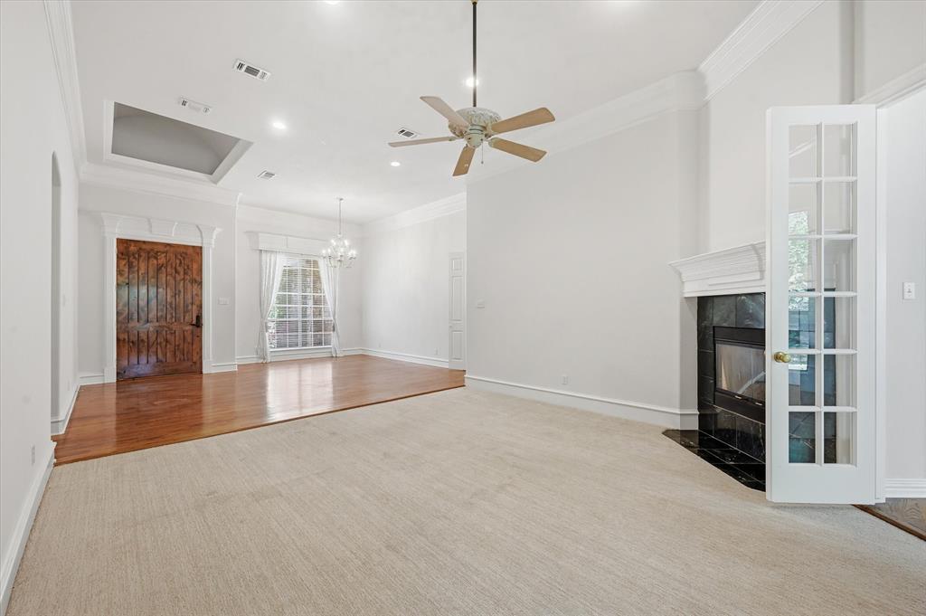 5513 Rustic Trail Colleyville, TX 76034 - Photo 7 of 40 an empty room with windows and fireplace