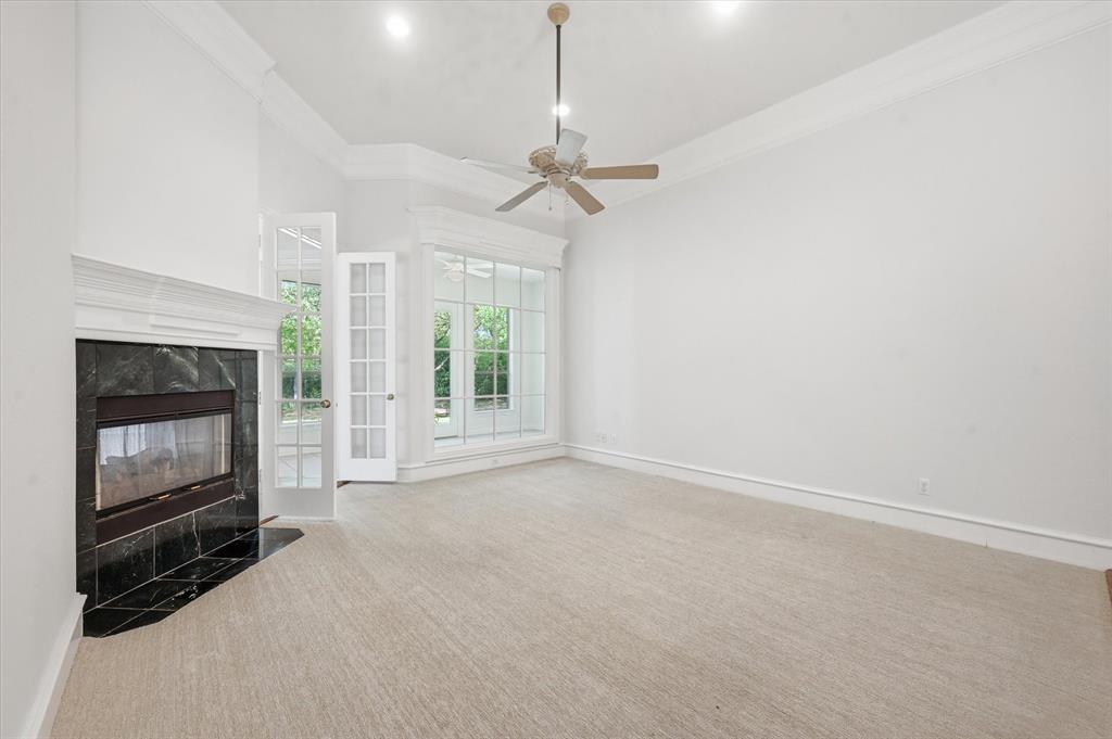 5513 Rustic Trail Colleyville, TX 76034 - Photo 8 of 40 an empty room with windows and fireplace