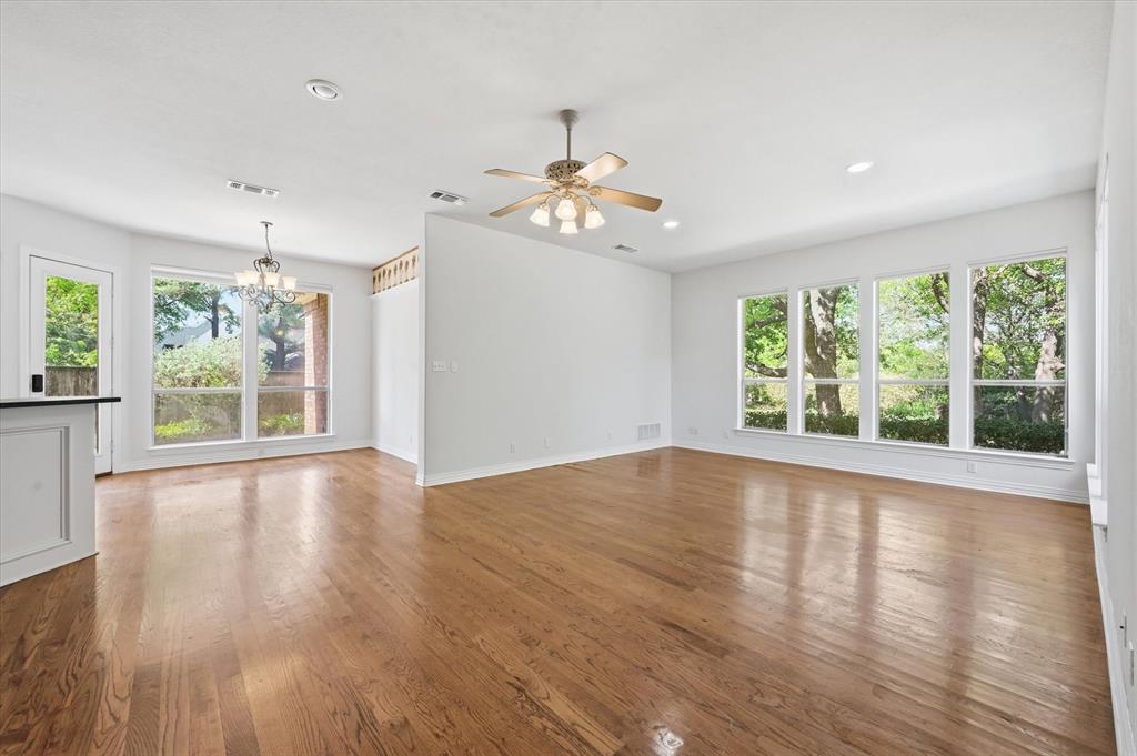 5513 Rustic Trail Colleyville, TX 76034 - Photo 10 of 40 a view of an empty room with wooden floor and a window