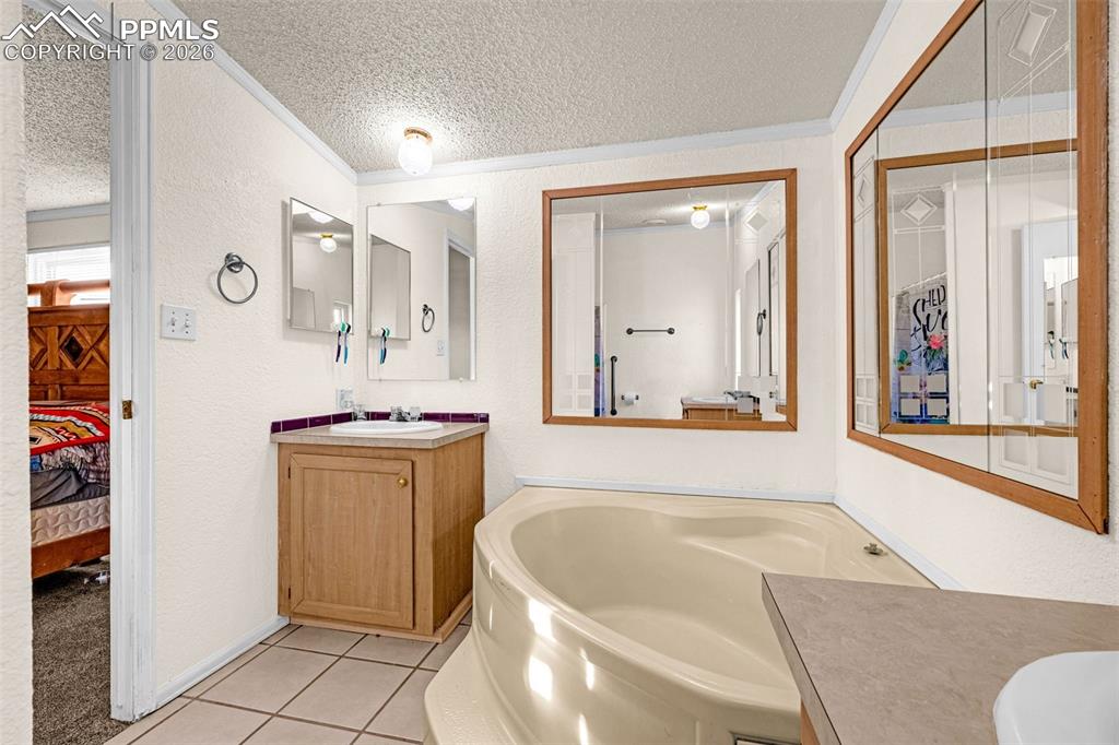 36925 Shear Road Yoder, CO 80864 - Photo 14 of 35 a bathroom with a bathtub and a sink