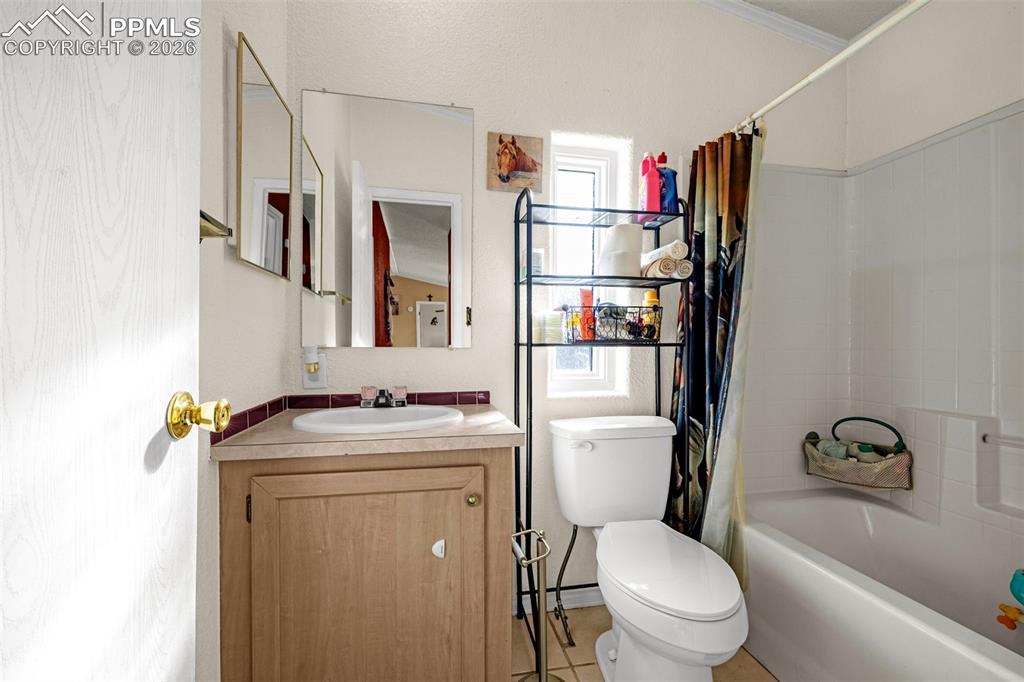 36925 Shear Road Yoder, CO 80864 - Photo 19 of 35 a bathroom with a toilet sink and shower