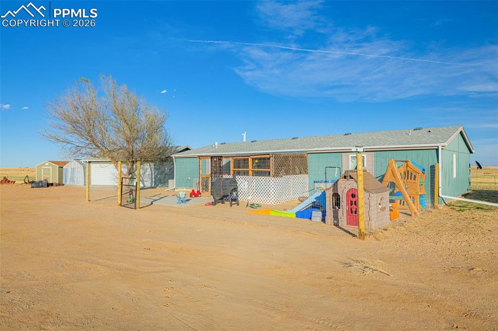 36925 Shear Road Yoder, CO 80864 - Photo 2 of 35 a view of a garage with a flat screen tv
