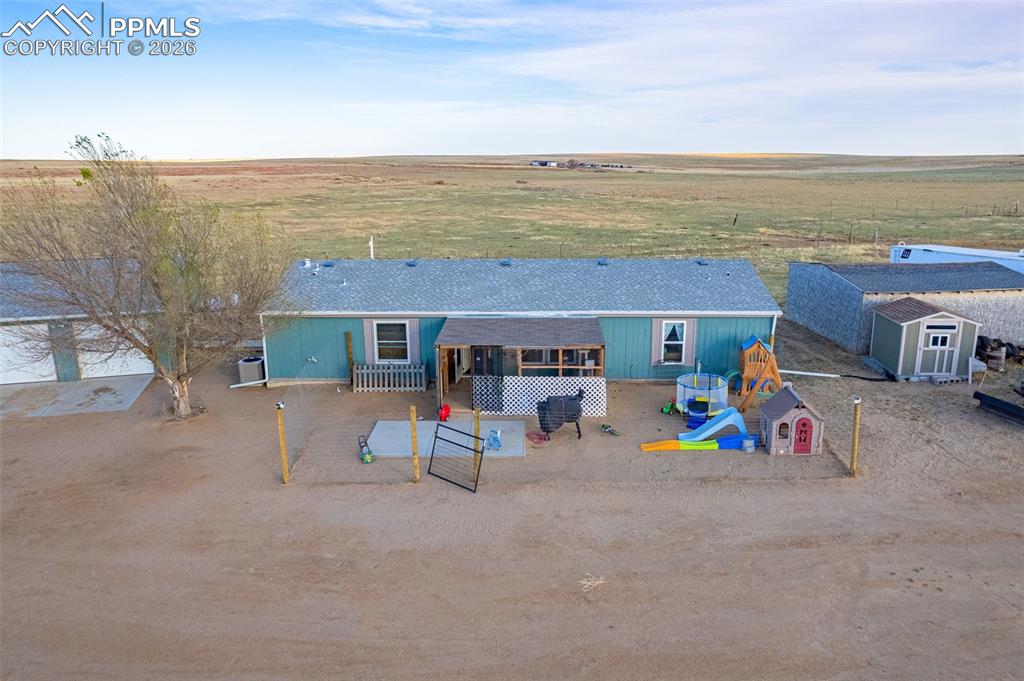 36925 Shear Road Yoder, CO 80864 - Photo 25 of 35 a view of a house with outdoor space and seating area