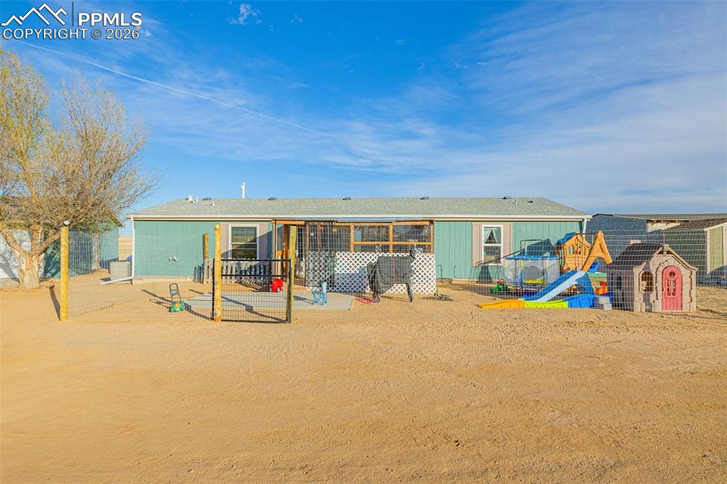 36925 Shear Road Yoder, CO 80864 - Photo 3 of 35 a view of a house with patio and a yard