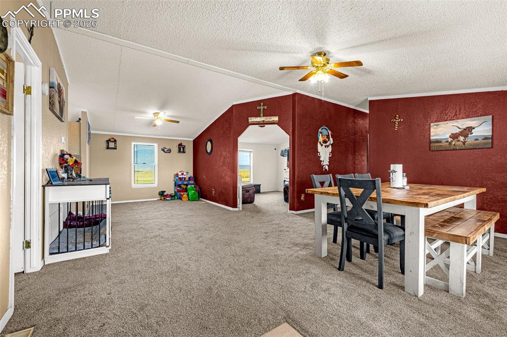 36925 Shear Road Yoder, CO 80864 - Photo 4 of 35 a living room with furniture a dining table and a piano