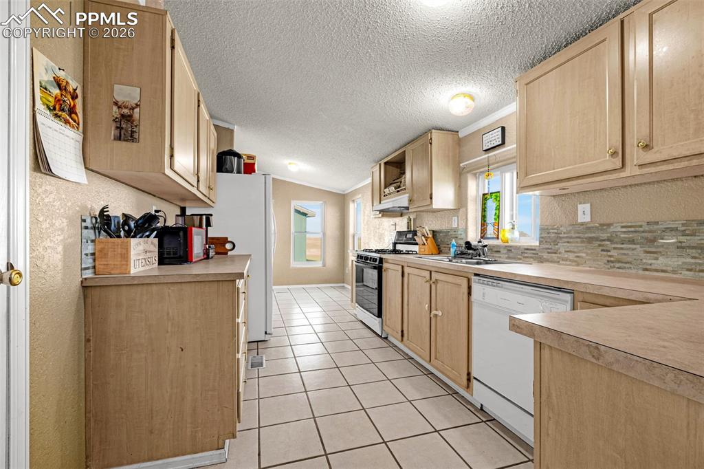 36925 Shear Road Yoder, CO 80864 - Photo 6 of 35 a kitchen with stainless steel appliances a refrigerator sink and cabinets