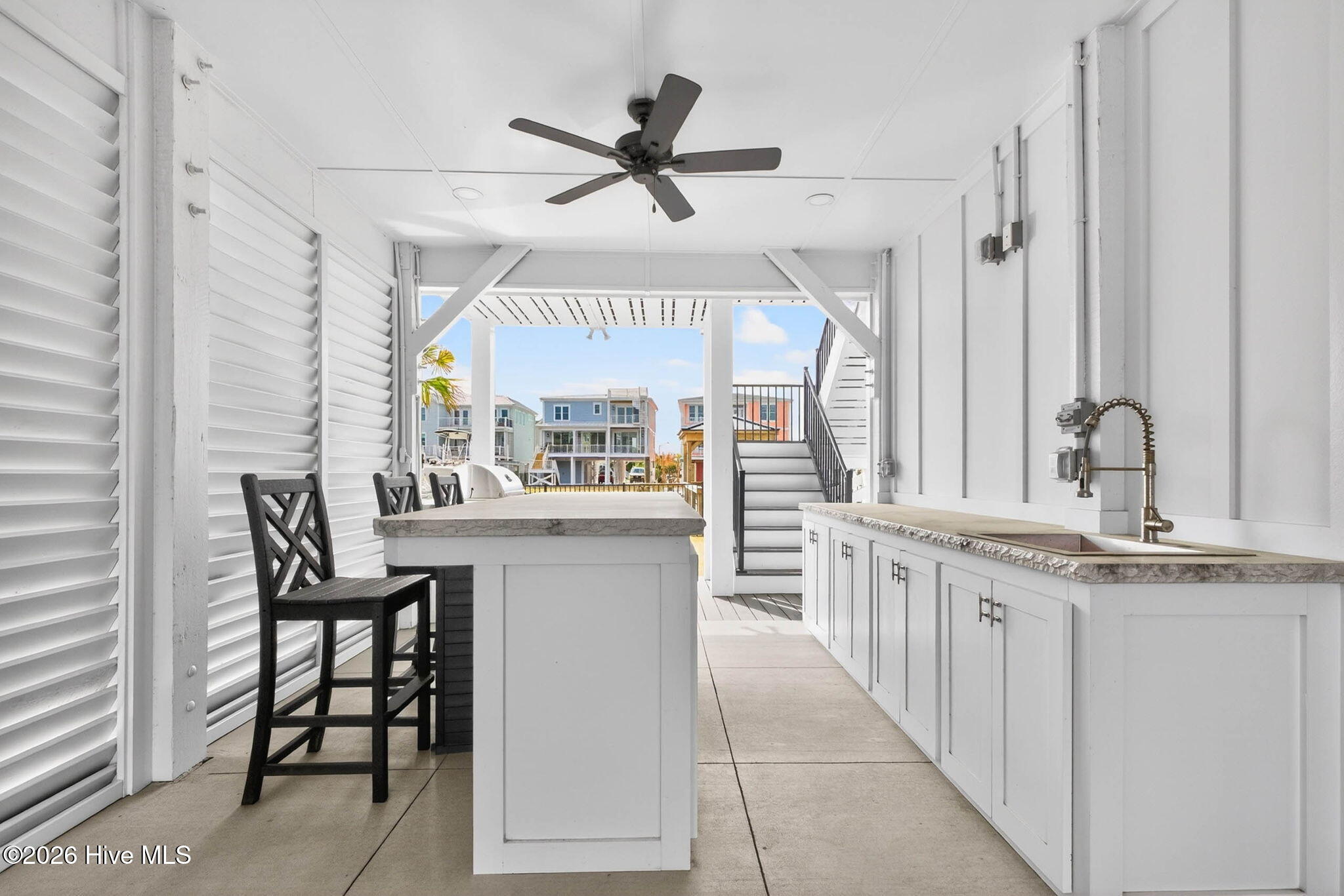1416 Riverside Drive Sunset Beach, NC 28468 - Photo 67 of 83 Custom outdoor kitchen with bar seating, perfect for entertaining in this Sunset Beach waterfront home.