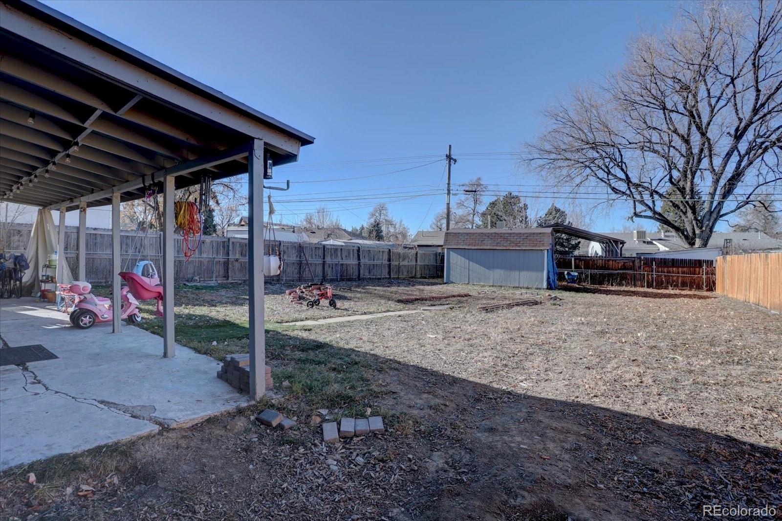 775 Victor Street Aurora, CO 80011 - Photo 18 of 21 a view of a backyard