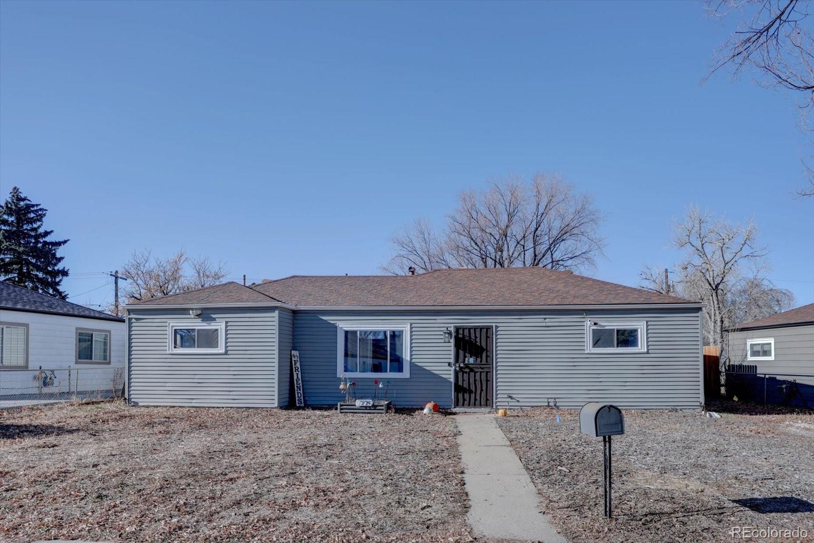 775 Victor Street Aurora, CO 80011 - Photo 20 of 21 a front view of a house with parking space