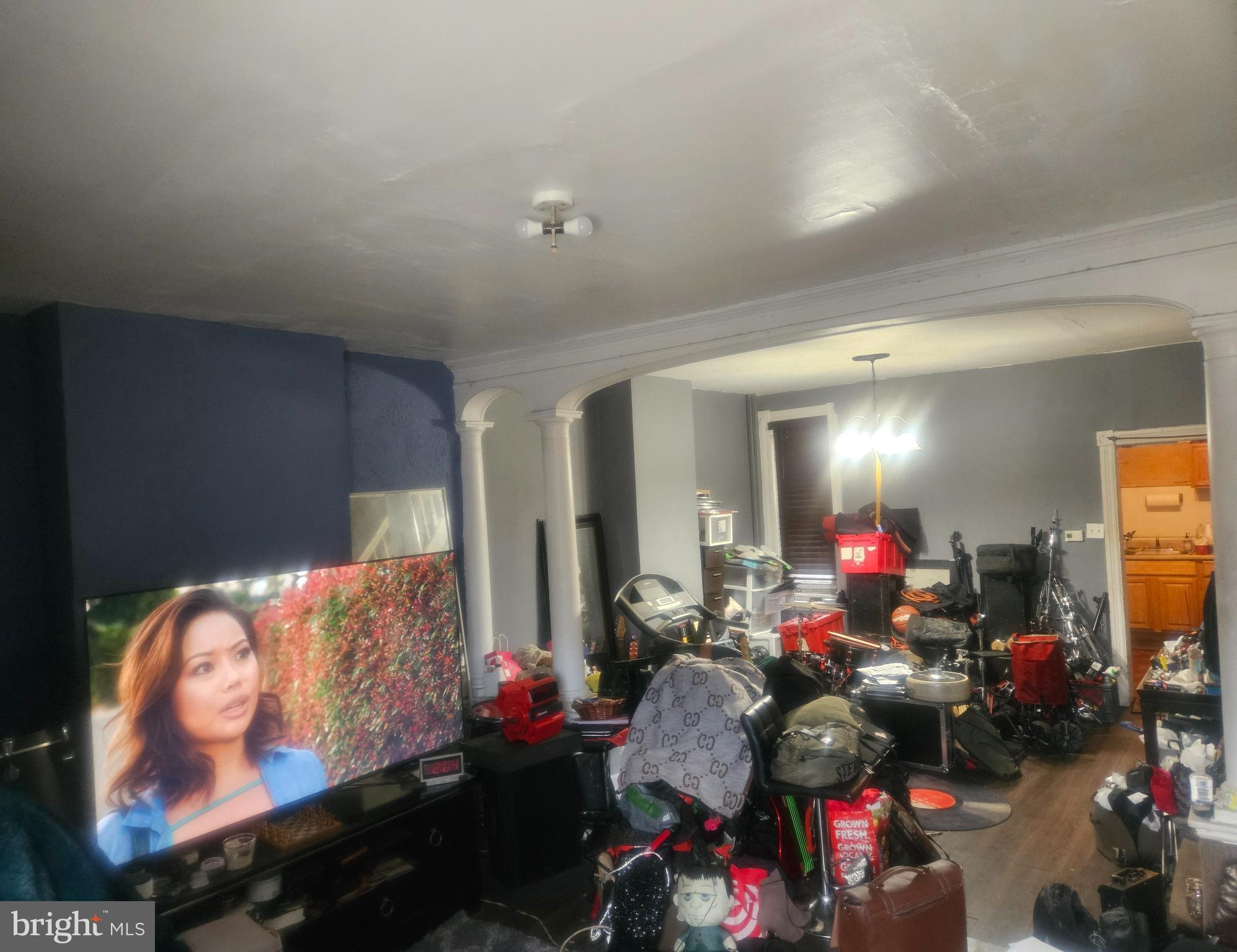 1213 South 49th Street Philadelphia, PA 19143 - Photo 3 of 8 a living room filled with furniture and a couch