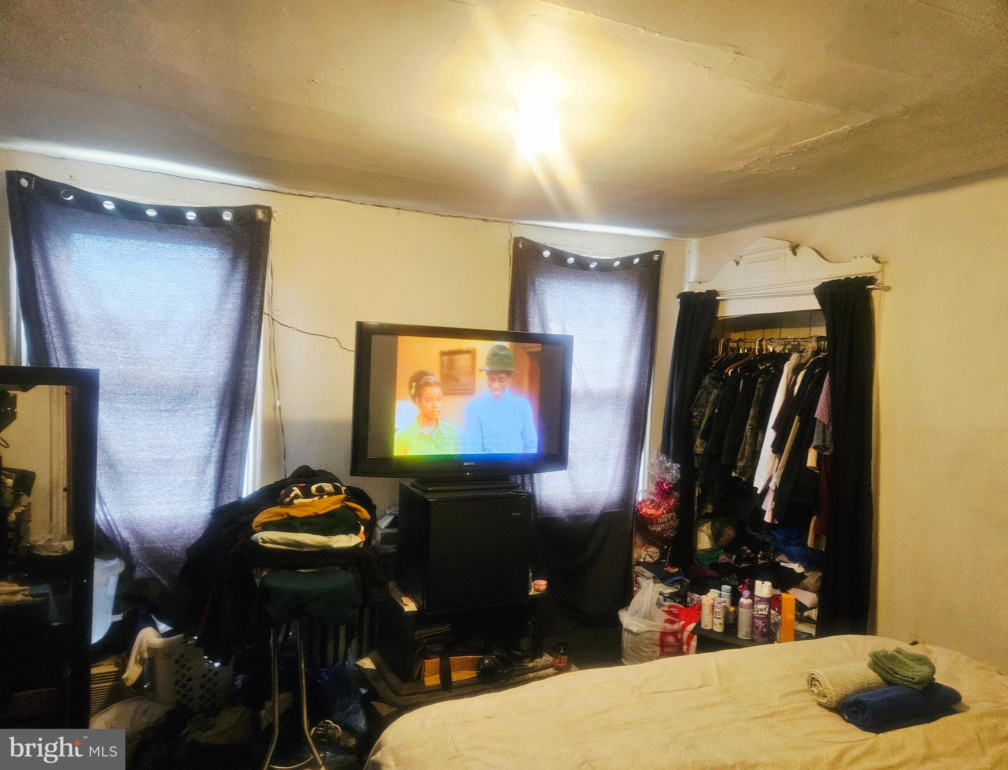 1213 South 49th Street Philadelphia, PA 19143 - Photo 7 of 8 a room with furniture and a flat screen tv