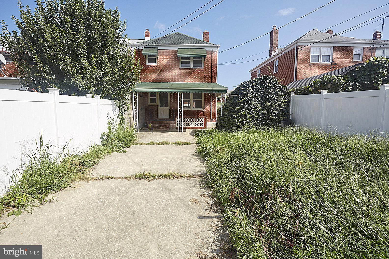 2223 Coralthorn Road Baltimore, MD 21220 - Photo 21 of 24 Rear parking pad and yard, grass has been cut