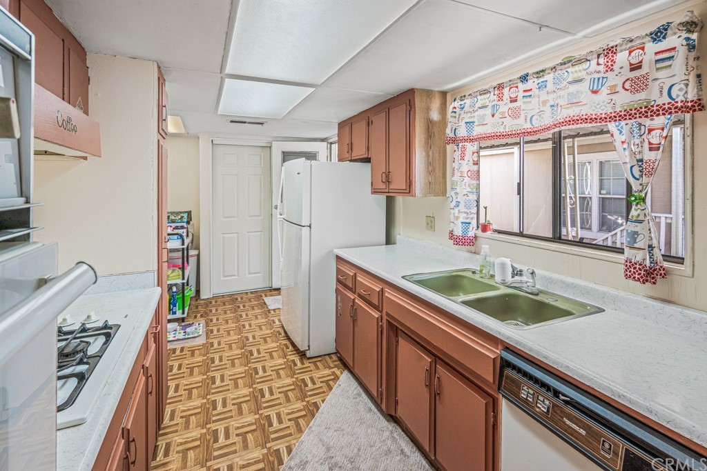 21811 Vera Street, Unit 58 Carson, CA 90745 - Photo 11 of 24 a bathroom with a granite countertop sink and a mirror
