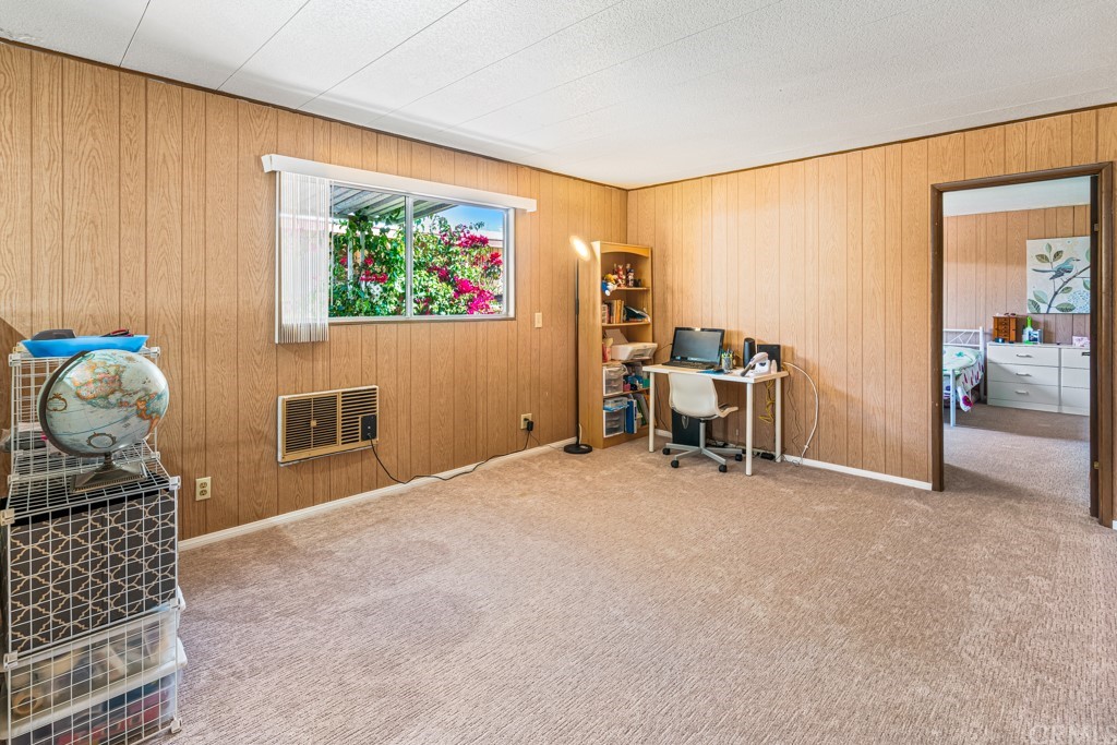 21811 Vera Street, Unit 58 Carson, CA 90745 - Photo 16 of 24 a room with furniture and workspace