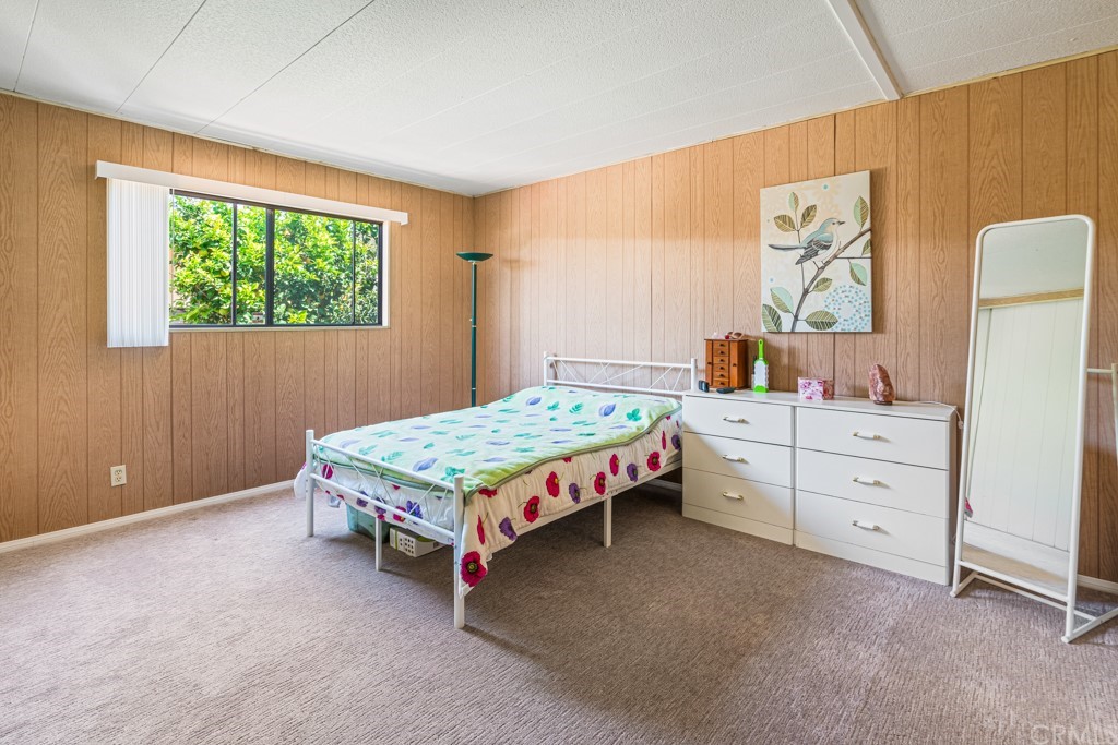 21811 Vera Street, Unit 58 Carson, CA 90745 - Photo 17 of 24 a bedroom with a bed and a window