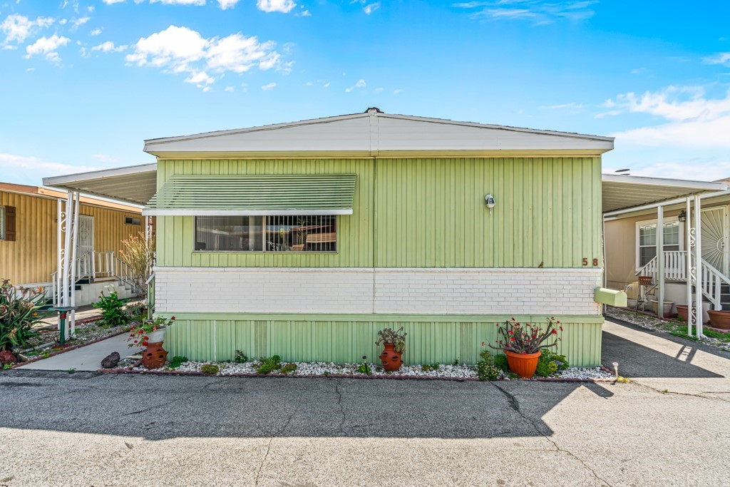 21811 Vera Street, Unit 58 Carson, CA 90745 - Photo 3 of 24 a view of a house with a patio