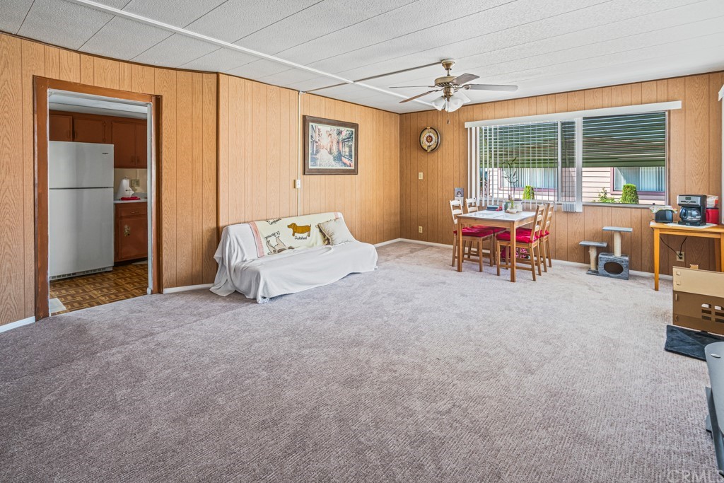 21811 Vera Street, Unit 58 Carson, CA 90745 - Photo 7 of 24 a view of a livingroom with furniture and a window