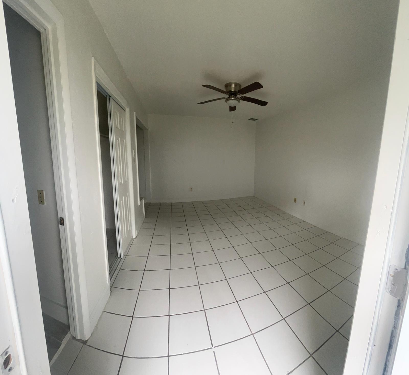 5930 Pierce Street, Unit 3 Hollywood, FL 33021 - Photo 2 of 10 a view of an empty room and window