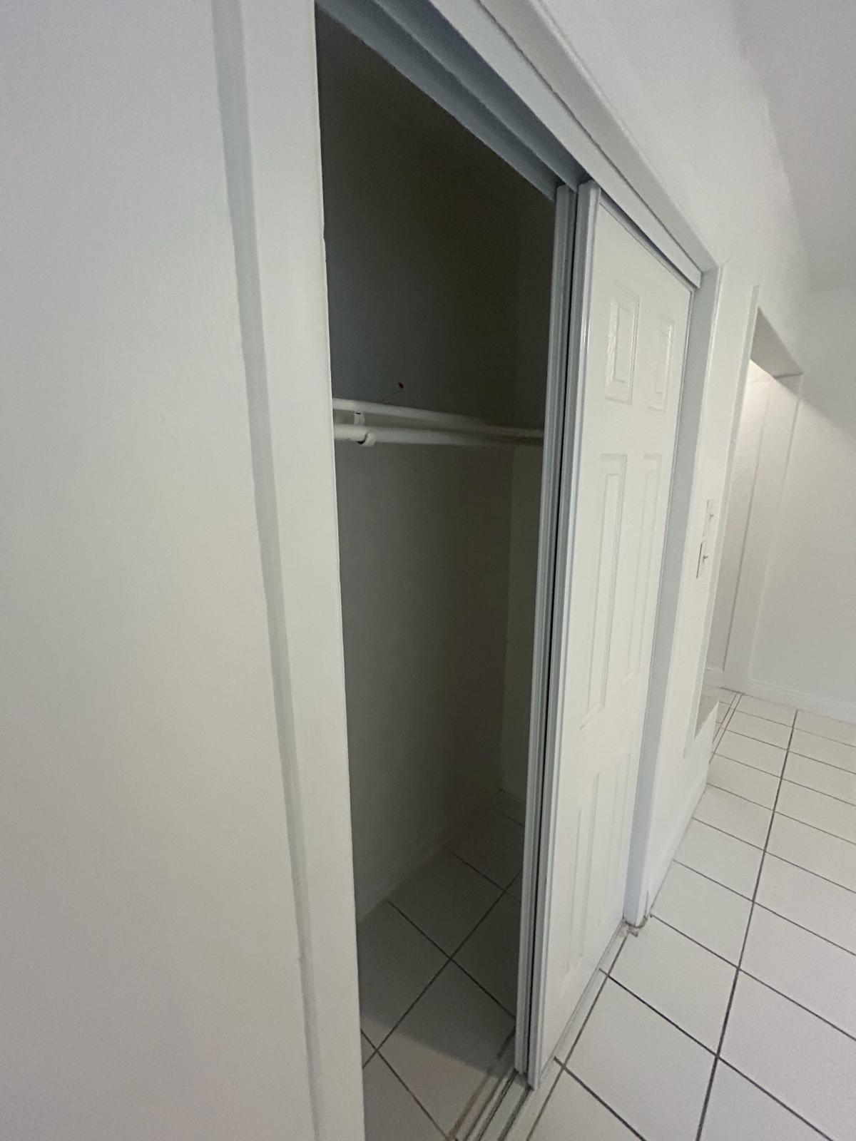 5930 Pierce Street, Unit 3 Hollywood, FL 33021 - Photo 6 of 10 a view of an empty walk in closet