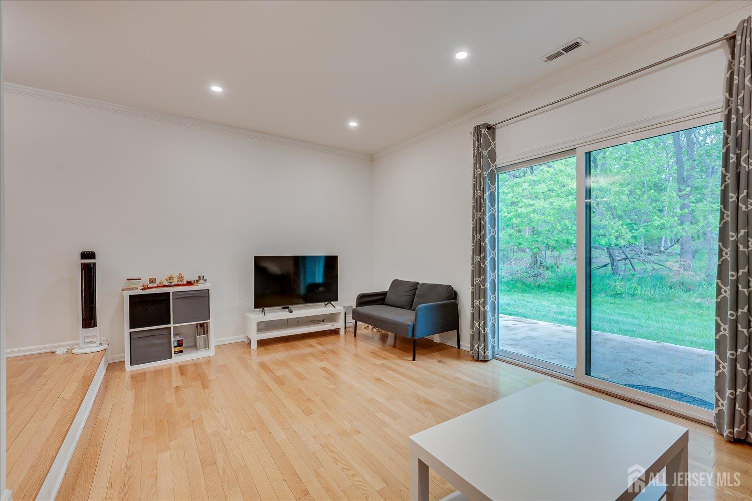903 Maplecrest Road Edison, NJ 08820 - Photo 11 of 24 a view of a livingroom with furniture and a flat screen tv