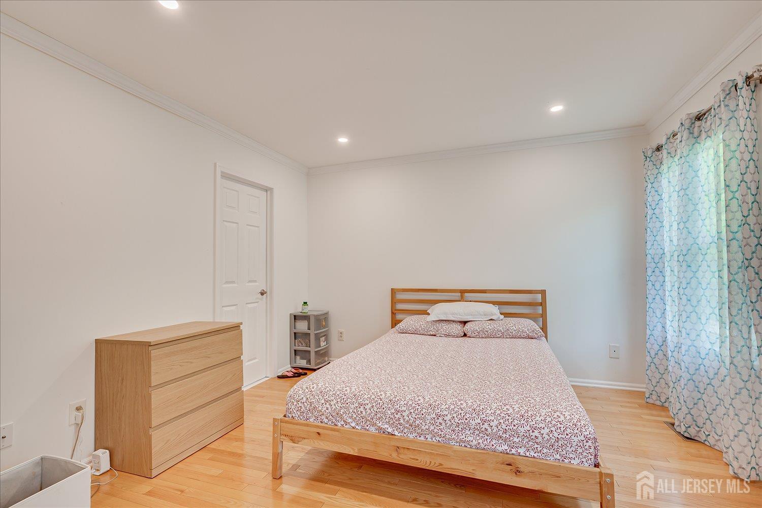903 Maplecrest Road Edison, NJ 08820 - Photo 14 of 24 a bedroom with a bed and a window