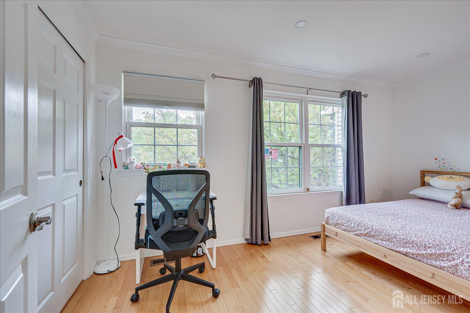 903 Maplecrest Road Edison, NJ 08820 - Photo 15 of 24 a bedroom with furniture and a window