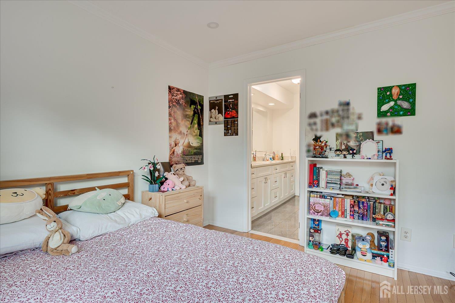 903 Maplecrest Road Edison, NJ 08820 - Photo 17 of 24 a bedroom with furniture and a book shelf