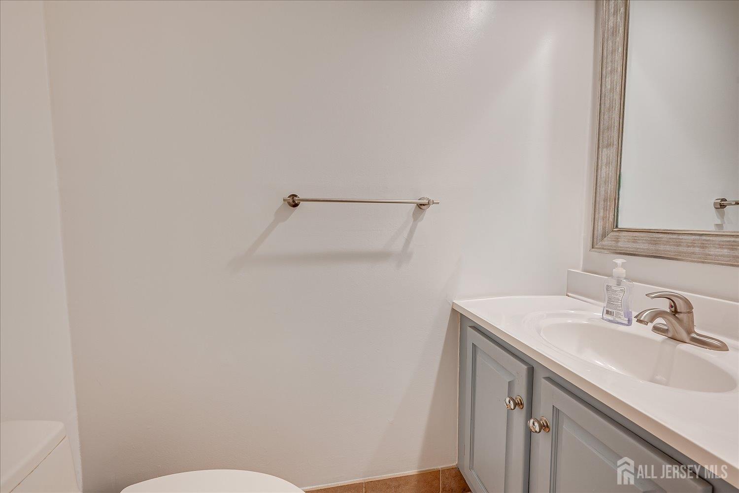 903 Maplecrest Road Edison, NJ 08820 - Photo 19 of 24 a bathroom with a sink toilet and vanity
