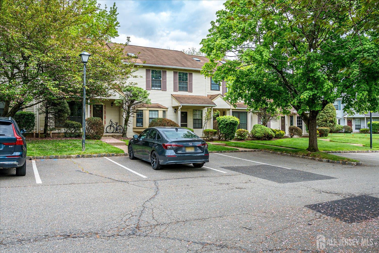 903 Maplecrest Road Edison, NJ 08820 - Photo 22 of 24 a car parked in front of a house