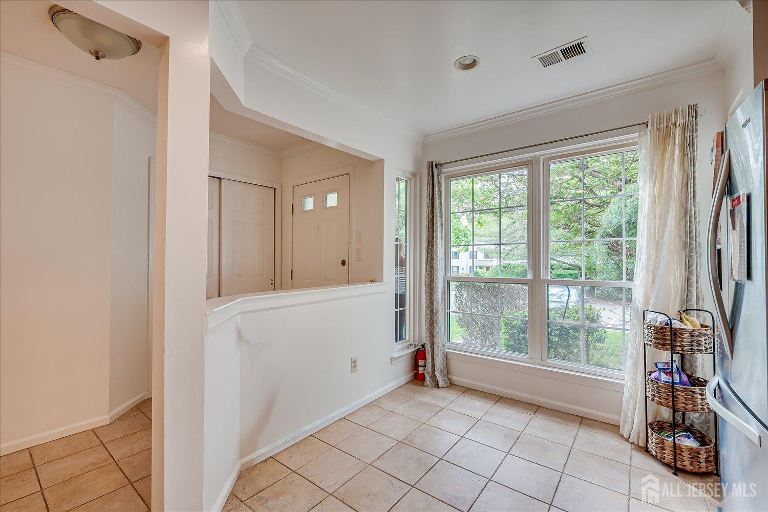 903 Maplecrest Road Edison, NJ 08820 - Photo 5 of 24 a view of an empty room with a window