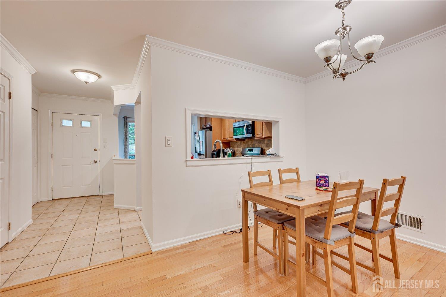 903 Maplecrest Road Edison, NJ 08820 - Photo 7 of 24 a view of a dining room with furniture and wooden floor